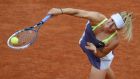 Maria Sharapova of Russia serves to Zheng Jie of China during their women’s singles match at the French Open tennis tournament at the Roland Garros stadium in Paris. Photograph: Stephane Mahe/Reuters