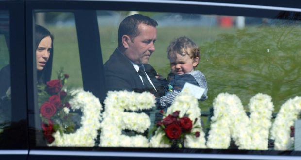 Dean Fitzpatrick’s father Christopher, carrying Dean’s son Leon and followed by Dean’s girlfriend Sarah O’Rourke, arrives at the Holy Trinity church in Donaghmede for Mr Fitzpatrick’s funeral. Photograph: Cyril Byrne