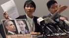 Pro-democracy lawmaker Claudia Mo holds a letter to US president Barack Obama, beside a combination photo featuring Obama and Edward Snowden, at a news conference in Hong Kong yesterday in support of Snowden. Photograph: Bobby Yip/Reuters