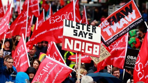 Protesters wave placards and flags during an anti-G8 demonstration in  Belfast. Photograph: Cathal McNaughton/Reuters
