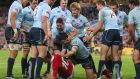 Jonny Sexton of the Lions is surounded by  Waratahs players . Photoraph: Mark Kolbe/Getty Images