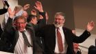 The North’s finance minister Sammy Wilson (left) and Sinn Féin president Gerry Adams taking part in an audience wave while waiting for US President Barack Obama during his visit to the Waterfront Hall, Belfast ahead of the G8 Summit in County Fermanagh. Photograph: PA