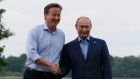 Britain’s prime minister David Cameron welcomes Russia’s President Vladimir Putin to the Lough Erne golf resort. Photograph: Suzanne Plunkett /Reuters