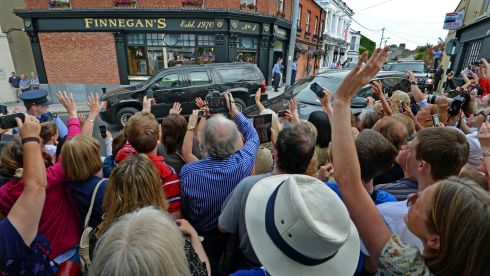 The crowd cheer as the cavalcade carrying the US First Lady Michelle Obama and her daughters, Malia and Sasha, pases through Dalkey, Co Dublin today. Photograph: Eric Luke/The Irish Times
