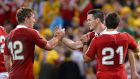 Jonathan Davies and Jonathon Sexton celebrate victory after the first match against  Australia. Photograph: Bradley Kanaris/Getty Images