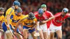 Clare’s Cian Dillon and Patrick Horgan tussle for possession with Cian McCarthy of Cork. Photograph: Cathal Noonan/Inpho