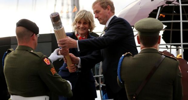 The eternal flame from John F Kennedy’s grave is delivered by Jean Kennedy Smith and Taoiseach Enda Kenny to the port of New Ross in Co Wexford on Saturday. Photograph: Niall Carson/PA Wire