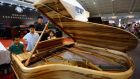  The Steinway & Sons piano zone at the Luxury China 2013 exhibition  in June in Beijing.  Photograoh:  Feng Li/Getty Images