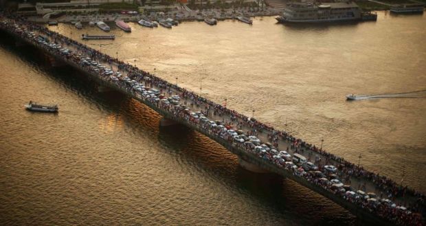 Protesters opposing Egyptian president Mohamed Morsi  on a Cairo bridge today during a protest demanding that he resign. Photograph: Suhaib Salem/Reuters 