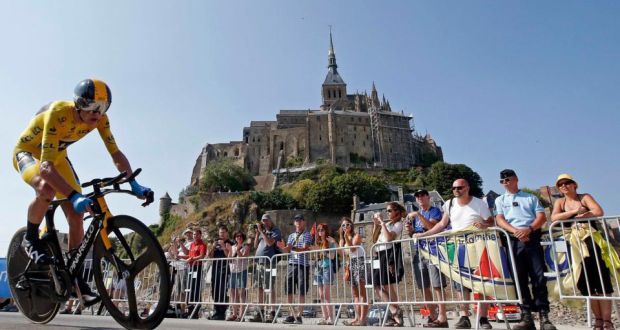 Team Sky rider yellow jersey holder Christopher Froome   cycles past  Mont Saint-Michel during the 32 km individual time trial eleventh stage of the centenary Tour de France. Photograph: Eric Gaillard/Reuters   