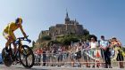 Team Sky rider yellow jersey holder Christopher Froome   cycles past  Mont Saint-Michel during the 32 km individual time trial eleventh stage of the centenary Tour de France. Photograph: Eric Gaillard/Reuters   