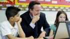 Britain’s prime minister David Cameron sits with pupils in a computer class at St Mary’s and St John’s CE School in north London. Chris Johns’ says the UK labour market has proved to be more flexible than previously thought but fears children are being educated with a view to taking the wrong jobs. Photograph: Getty Images. 