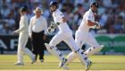 England’s Joe Root and Alastair Cook (right) run between  wickets during day two of the Ashes Test at Lord’s.