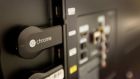 The new Google ChromeCast  connected to the the back of a television. Photograph: Tony Avelar/Bloomberg