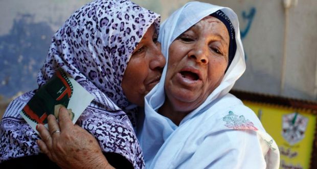 The mother (R) of Palestinian Ateya Abu Moussa, who has been held prisoner by Israel for 20 years, reacts as she is hugged by her sister after hearing news on the possible release of her son. Abu Moussa was expected to be among more than 100 Arab prisoners to be released as a step to renew stalled peace talks with the Palestinians in Washington today. Photograph: Reuters