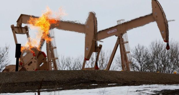Natural gas flares are seen at an oil pump site outside of Williston, North Dakota. Photograph: Shannon Stapleton/Reuters