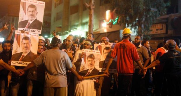 Supporters of deposed Egyptian president Mohamed Morsi take part in an anti-army rally in Cairo last night. Photograph: Asmaa Waguih/Reuters.