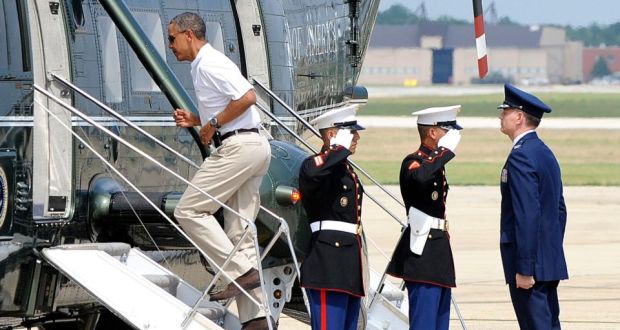 President Barack Obama boards Marine One to fly to Camp David yesterday at Andrews AirForce Base. Photograph: Getty  