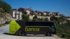 A travelling bank bus drives down the road after making its monthly call on customers in the village of Maderuelo, central Spain. Photograph: Sergio Perez/Reuters 