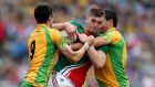 Donegal’s Rory Kavanagh and Frank McGlynn find Mayo’s Aidan O’Shea a real handful.