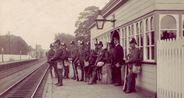 RIC officers wait at a train station, possibly Clontarf in Dublin: “we are determined these much-maligned men will not be forgotten”.