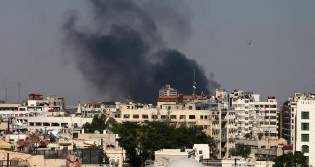 Black columns of smoke rise from heavy shelling in the Jobar neighborhood, east of Damascus, Syria yesterday. Photograph: Hassan Ammar/AP