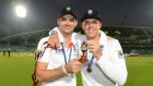 England’s James Anderson and Graeme Swann pose with a replica urn after the fifth Ashes cricket test match against Australia. REUTERS/Philip Brown