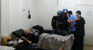 UN chemical weapons experts visit a hospital where wounded people affected by an apparent gas attack are being treated, in the southwestern Damascus suburb of Mouadamiya, yesterday. Photograph: Abo Alnour Alhaji 