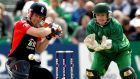  England’s Eoin Morgan and Niall O’Brien of Ireland during a one-day match in Clontarf in 2011. Photograph: James Crombie/Inpho
