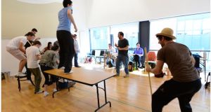 Conall Morrison (centre) works with young actors at the Lab on Dublin’s Foley Street. Photograph: Bryan O’Brien 