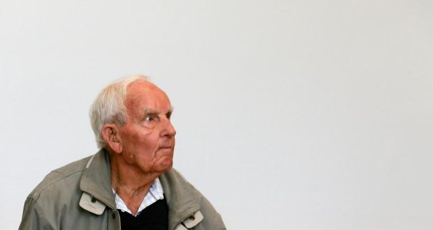 Siert Bruins, a suspected Nazi war criminal, stands in a courtroom at the start of his trial in the German city of Hagen. REUTERS/Wolfgang Rattay 