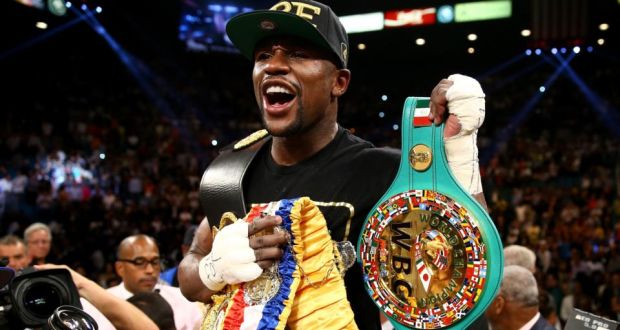 Floyd Mayweather Jr celebrates his majority decision victory against Canelo Alvarez in their WBC/WBA 154-pound title fight at the MGM Grand Garden Arena in Las Vegas, Nevada. Photograph: Al Bello/Getty Images
