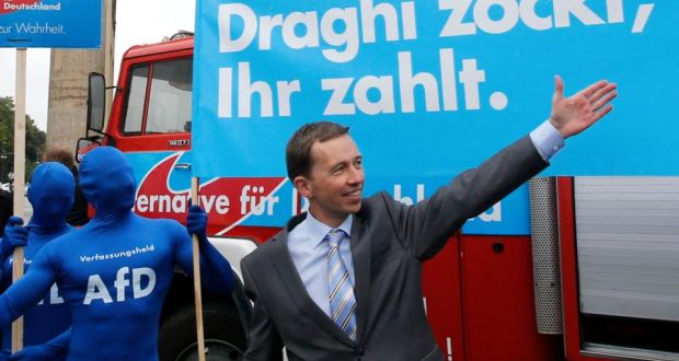 Bernd Lucke, the leader of the euro-critical Alternative for Germany party (AfD) in front of a campaign poster during an election campaign rally in Berlin. The placard reads “Draghi gambles, you pay”. Photograph: Reuters