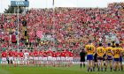 Clare and Cork stand to attention before the national anthem prior to the start of the drawn All-Ireland final earlier this month. Photo: James Crombie/Inpho