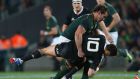 Bismarck Du Plessis of South Africa tackles Dan Carter of the All Blacks at Eden Park on September 14th. Du Plessis received a yellow card for the tackle. Photograph: Sandra Mu/Getty Images