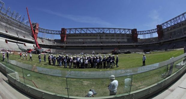 Representatives of Fifa and the local organising committee visiting the Arena da Baixada Stadium in March  2012. Photograph:  Heuler Andrey/LatinContent/Getty Images