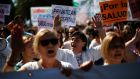 Healthcare workers and supporters take part in a protest against the local government’s plans to cut public healthcare spending in Madrid last month. Photograph:  Reuters