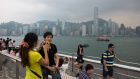 Tourists in Hong Kong. In the “Guidebook to Civilised Tourism”, flyers are recommended not to take life jackets kept underneath aircraft seats because “if a dangerous situation arises then someone else will not have a life jacket.”  Photograph: Lam Yik Fei/Bloomberg