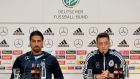 Germany’s Mesut Ozil, right, and Sami Khedira at yesterday’s  press conference  in Cologne. Photograph: Martin Meissner/AP