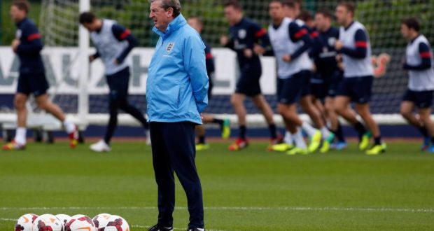 England’s manager Roy Hodgson watches a training session ahead of their World Cup qualifyier against Poland.