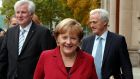 Angela Merkel, leader of the Christian Democratic Union, Horst Seehofer (left), leader of the Christian Social Union, with German transport minister Peter Ramsauer following preliminary talks with the SPD in Berlin yesterday. Photograph: Fabrizio Bensch/Reuters 