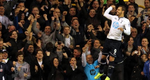Tottenham’s Roberto Soldado celebrates after scoring the controversial spot kick.