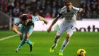 Swansea’s Angel Rangel takes the ball past West Ham’s Matt Jarvis during the Barclays Premier League match at the Liberty Stadium, Swansea. Photograph: Andy Lloyd/PA Wire