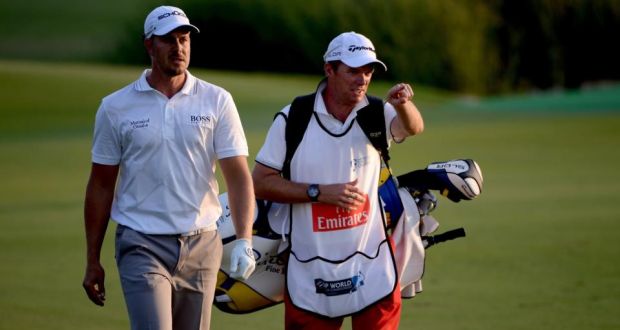 Henrik Stenson of Sweden (left) during the third round of the 2013 DP World Tour Championship on the Earth Course at the Jumeirah Golf Estates in Dubai, United Arab Emirates. Photograph:  Ross Kinnaird/Getty Images