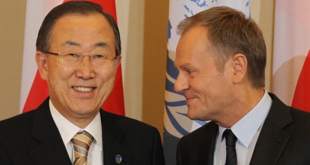 Polish Prime Minister Donald Tusk (R) and UN Secretary General Ban Ki-moon (L) pose for the media during a meeting in Warsaw, Poland