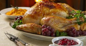 A typical Thanksgiving meal, including roast turkey, cranberry sauce and pumpkin 