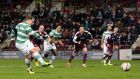 Celtic’s Kris Commons scores from the penalty spot to complete his hat-trick during the Scottish Cup fourth-round match against Hearts at Tynecastle. Photograph: Kirk O’Rourke/PA 