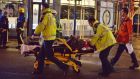 Paramedics attend to an injured person at the Apollo Theatre in Shaftesbury Avenue, central London, last night after part of celining collapsed during a performance. Photograph: Dominic Lipinski/PA Wire.