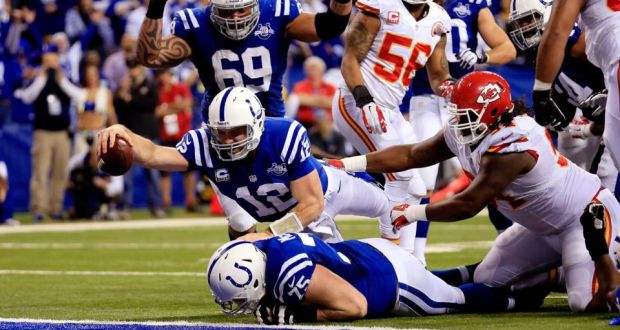 Indianapolis quarterback Andrew Luck stretches out to score a  touchdown in the fourth quarter of their NFl wild-card play-off game against Kansas City Chiefs  at Lucas Oil Stadium  in Indianapolis. Photograph: Rob Carr/Getty Images