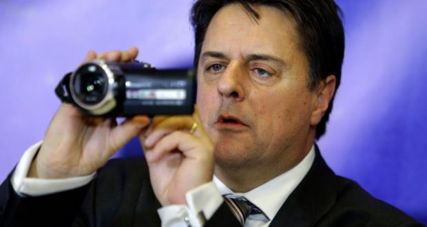 British National Party leader Nick Griffin uses a video camera during a news conference in Athens yesterday. Photograph: AP Photo/Thanassis Stavrakis